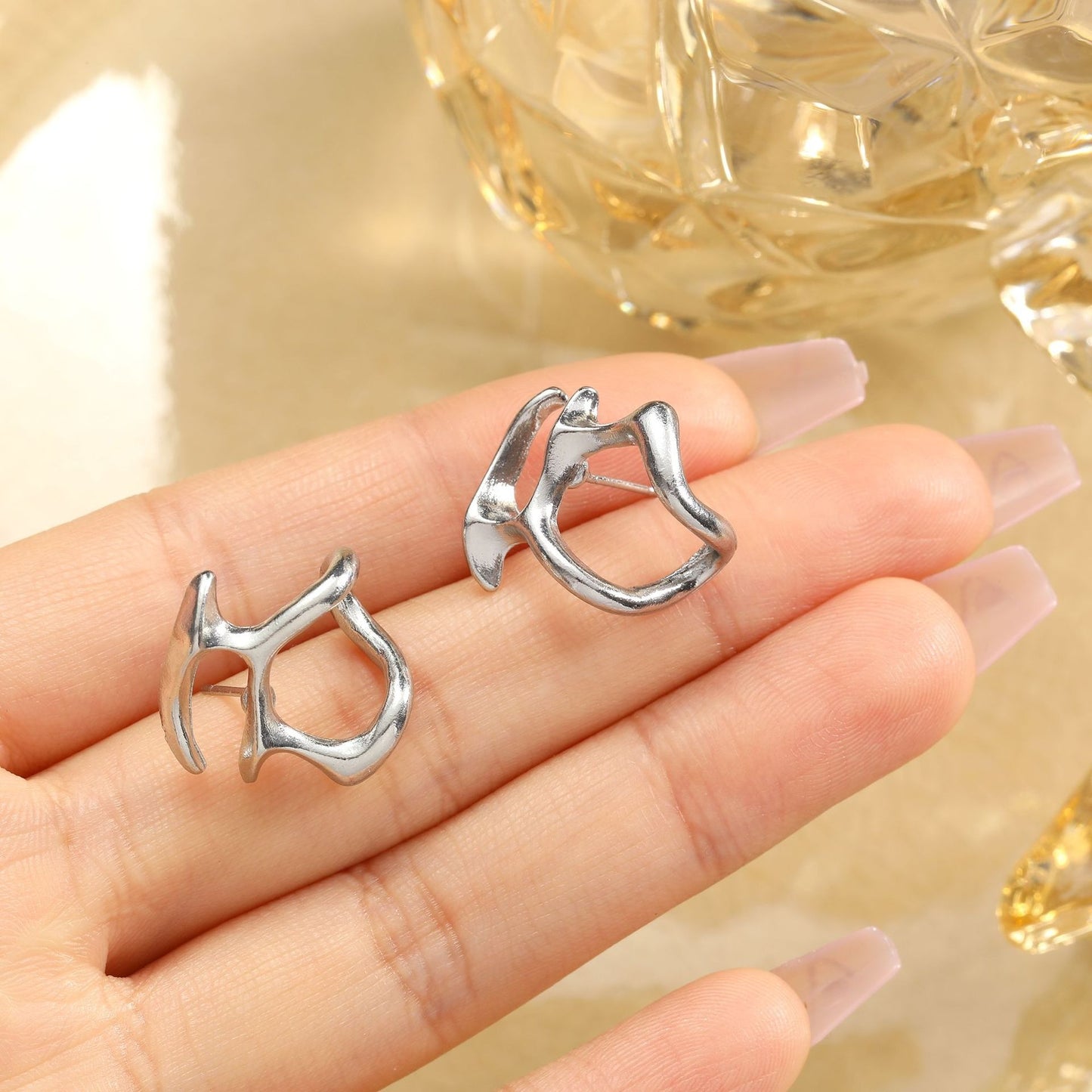 Hot selling cold wind irregular hollow out metal earrings for female personality niche design, internet celebrity high-end sense earrings