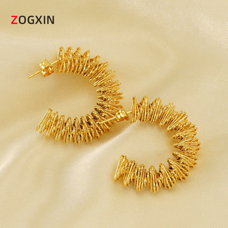 Cross border European and American stainless steel spring earrings with irregular hollow design