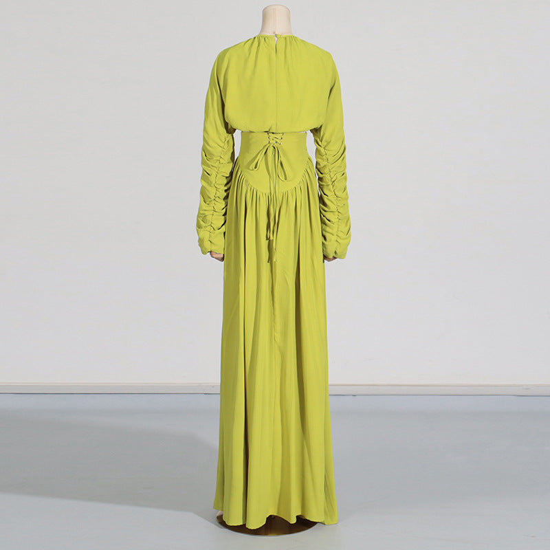 Women's set consisting of an elegant wrinkled cropped top and a high-waisted draped half skirt