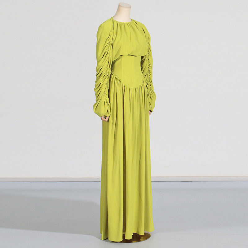 Women's set consisting of an elegant wrinkled cropped top and a high-waisted draped half skirt