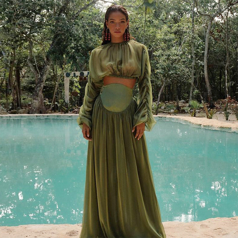Women's set consisting of an elegant wrinkled cropped top and a high-waisted draped half skirt