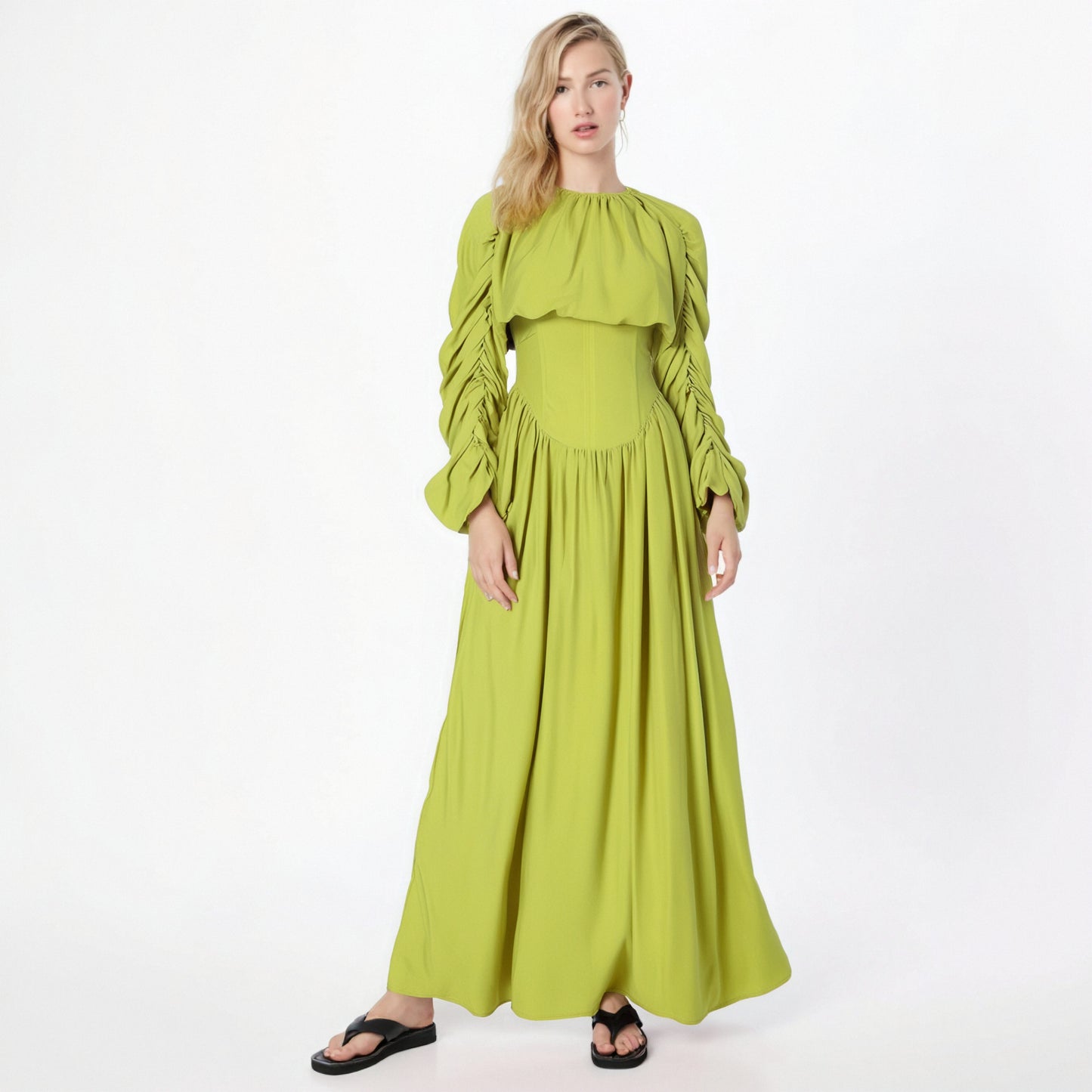 Women's set consisting of an elegant wrinkled cropped top and a high-waisted draped half skirt