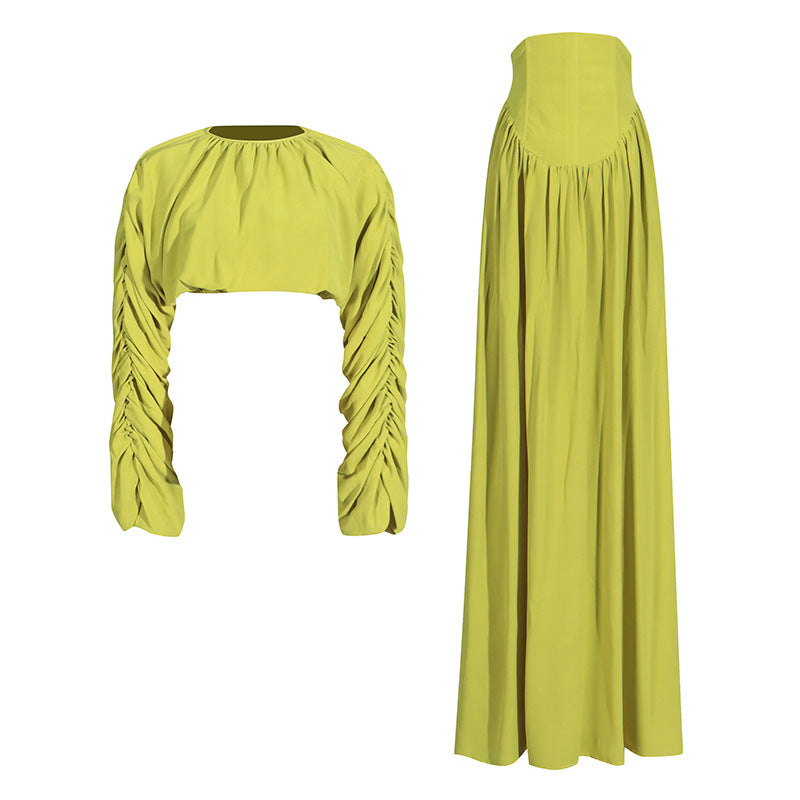 Women's set consisting of an elegant wrinkled cropped top and a high-waisted draped half skirt