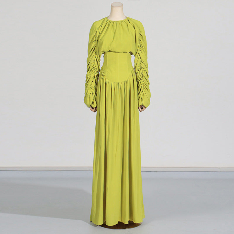 Women's set consisting of an elegant wrinkled cropped top and a high-waisted draped half skirt